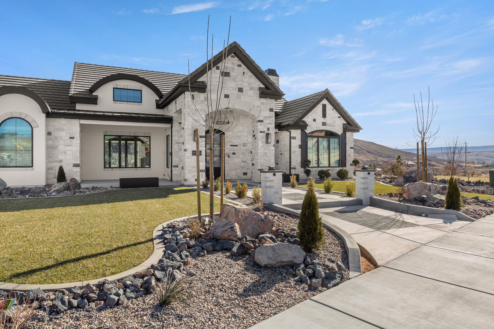 A large white house with a lot of windows is for sale.