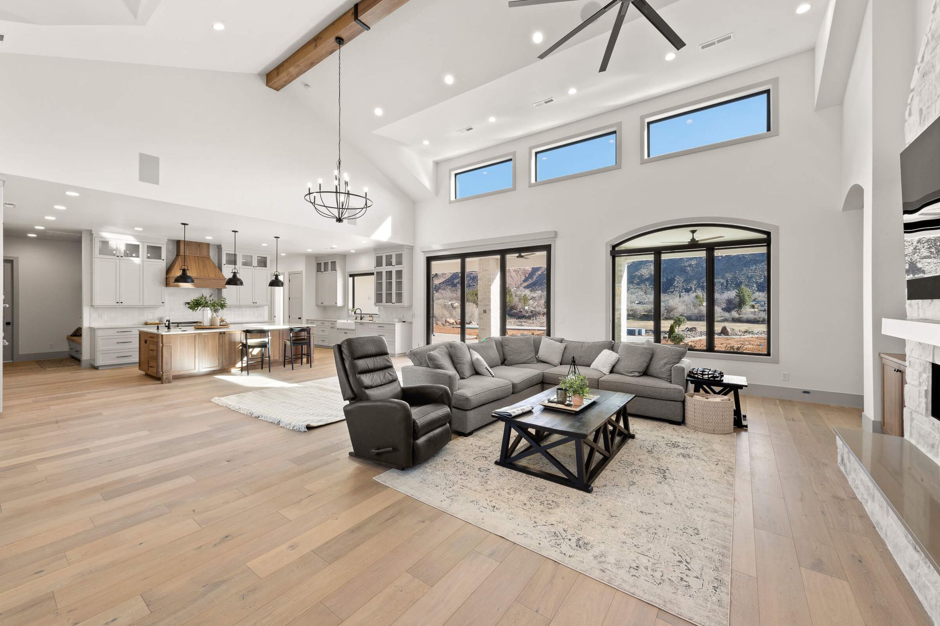 A living room filled with furniture and a ceiling fan.