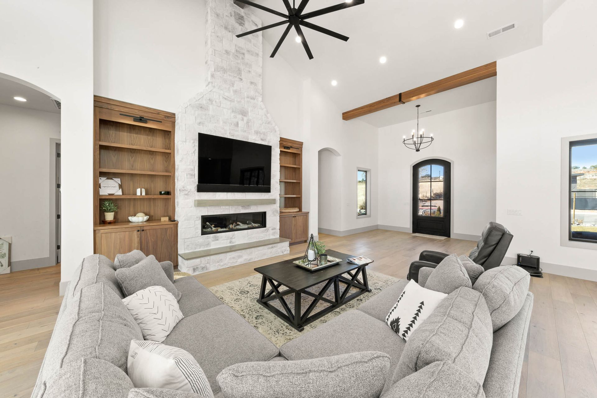 A living room filled with furniture and a flat screen tv.