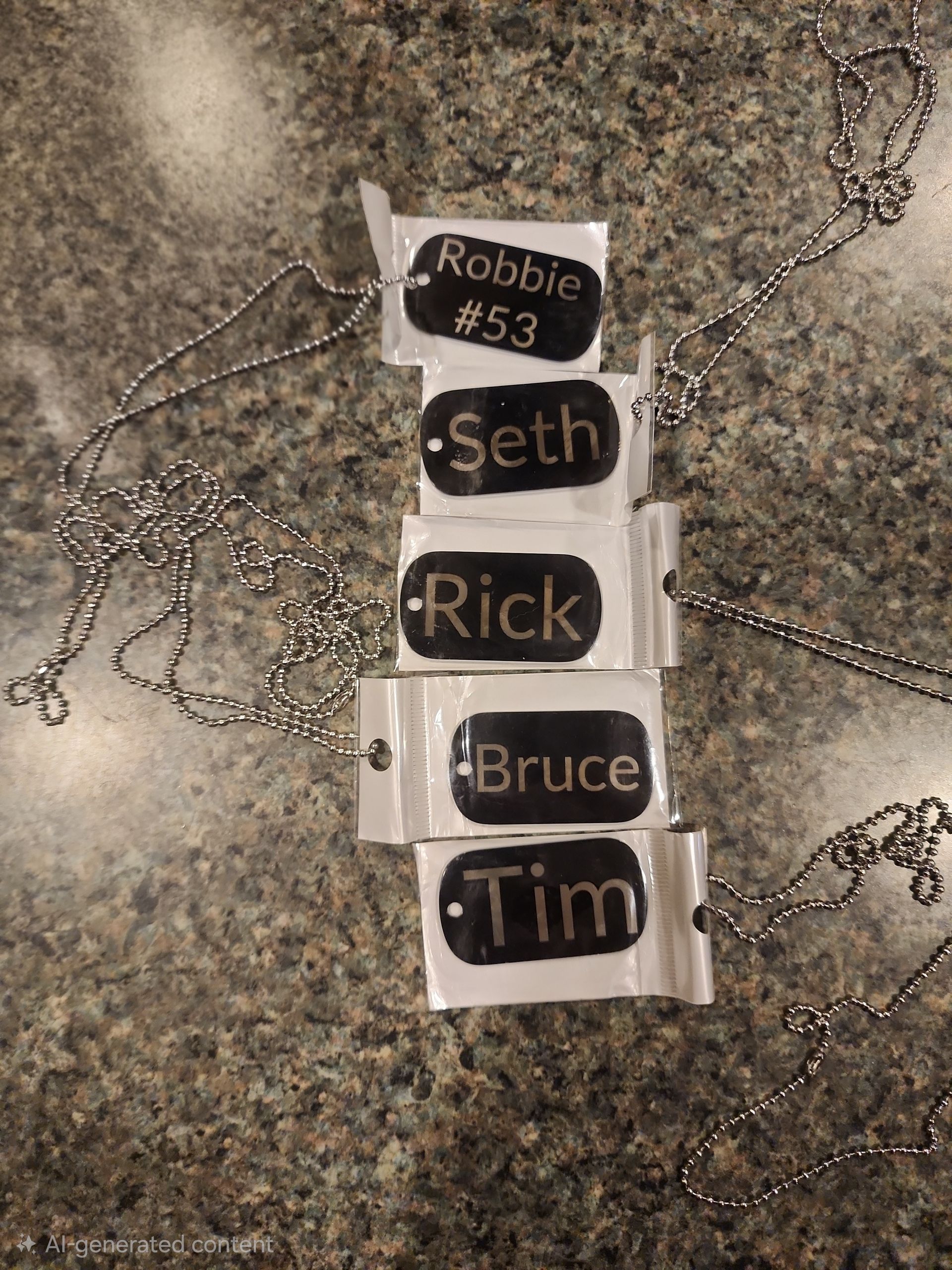 Five black name tags on tape on a speckled countertop, labeled Robbie #53, Seth, Rick, Bruce, and Tim