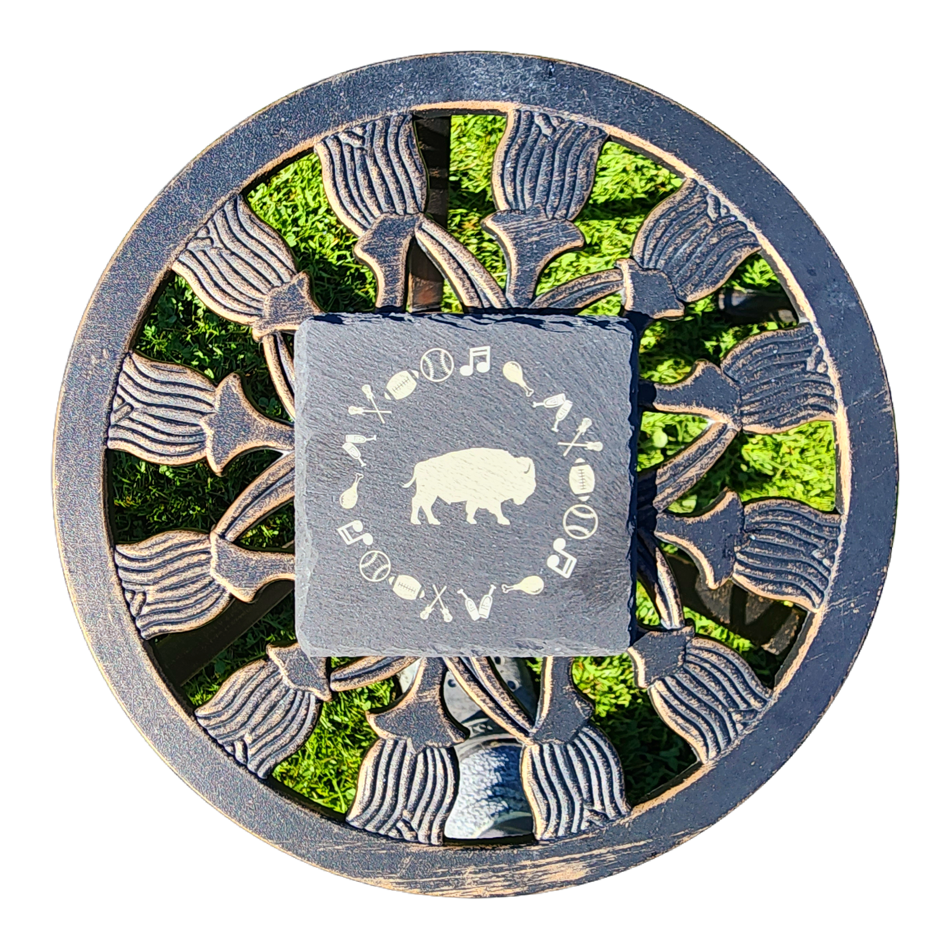 Circular decorative emblem with green, gray, and black abstract pattern around a central square logo