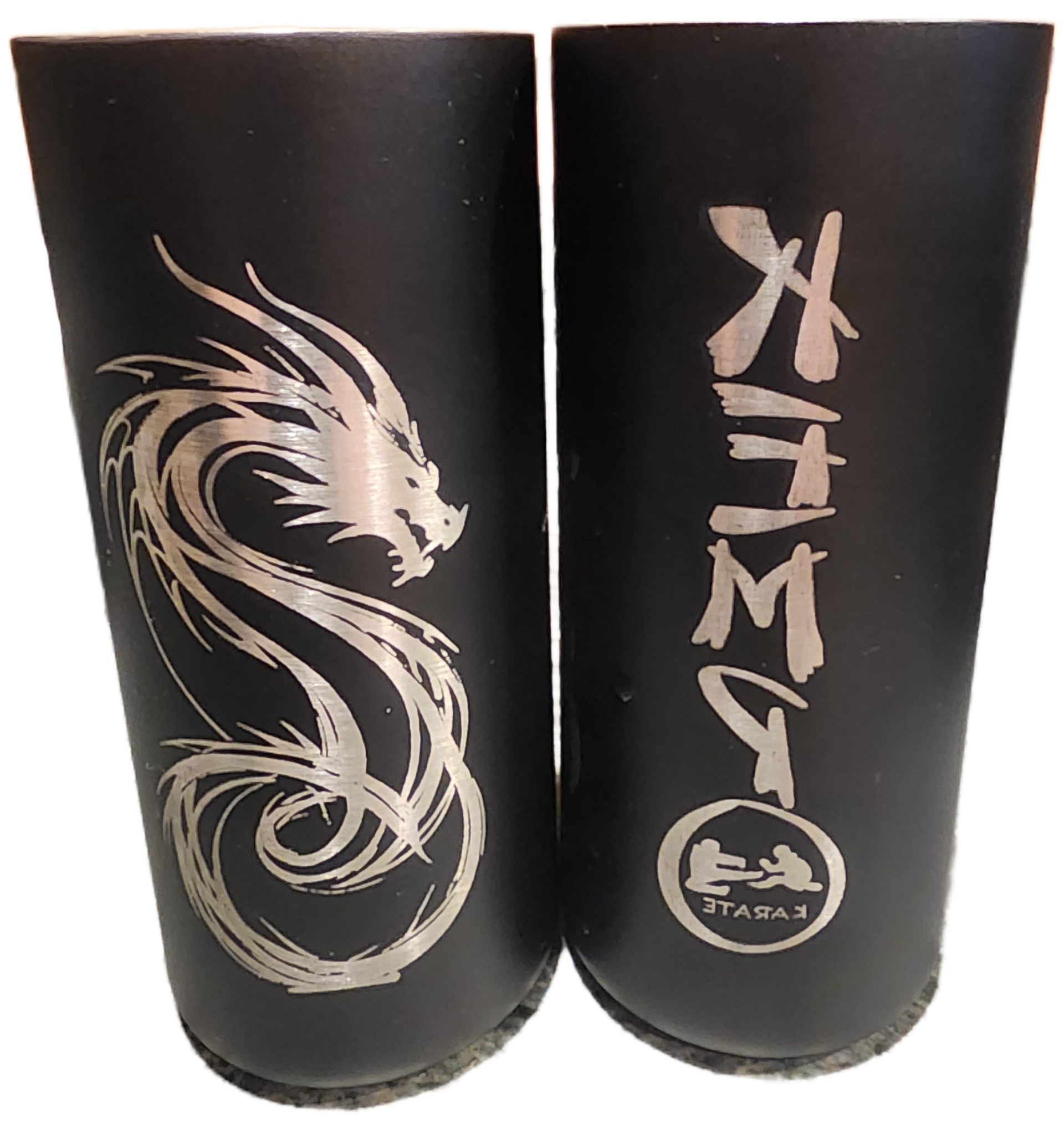 Two black cylindrical cups with silver dragon artwork and vertical Japanese-style lettering