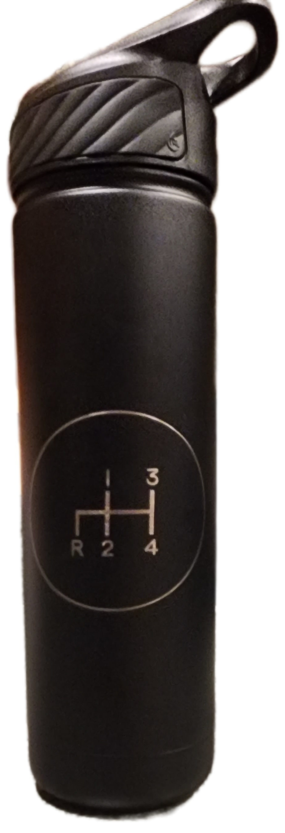 Black gear shift knob with 4-speed shift pattern on top and rounded loop handle.