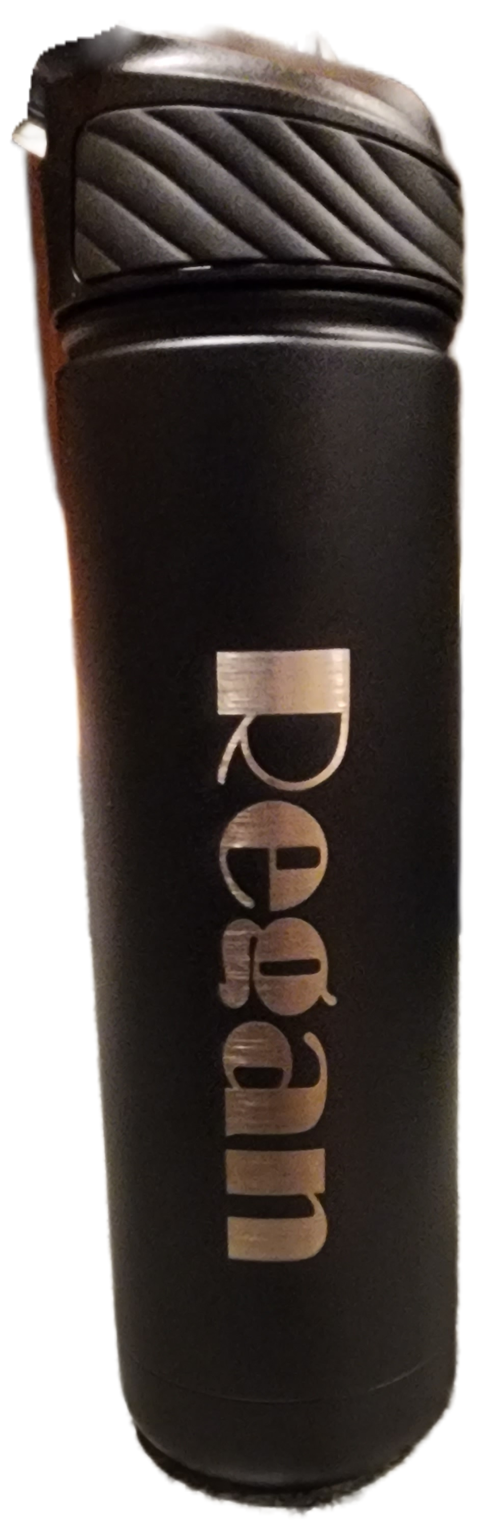 Black cylindrical deodorant stick with silver “Rexan” label and textured gray cap