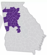 Map of Georgia with highlighted counties in purple, concentrated in the central and western regions.