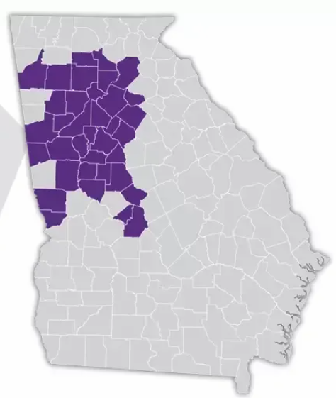 Map of Georgia with highlighted counties in purple, concentrated in the central and western regions.