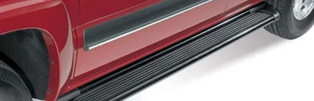 Red SUV side panel with black running board and chrome trim on a white background