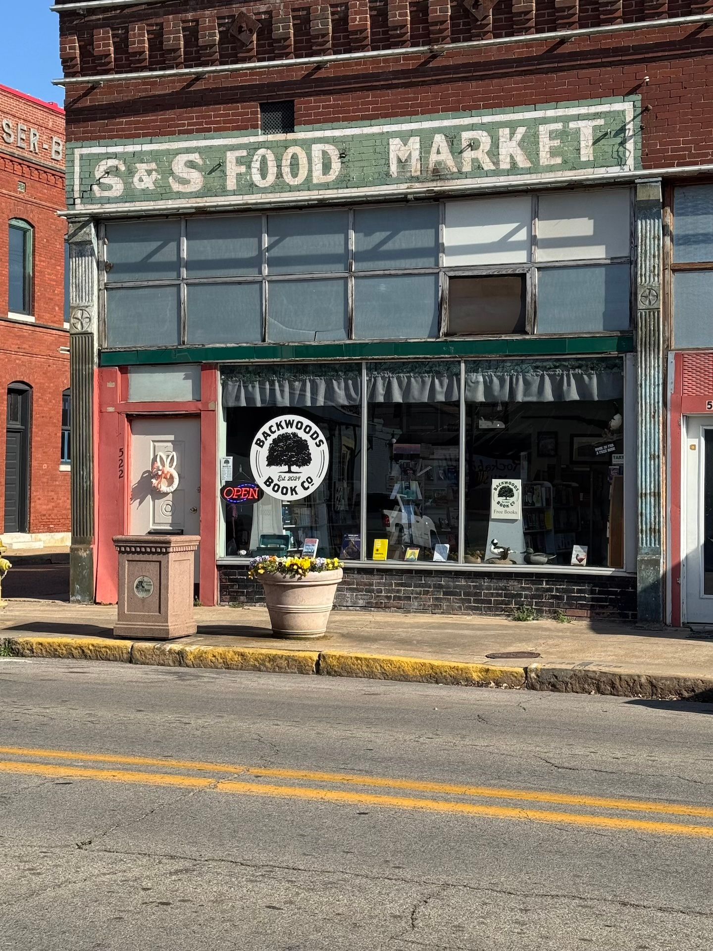 the storefront view of the backwoods bookstore from the road