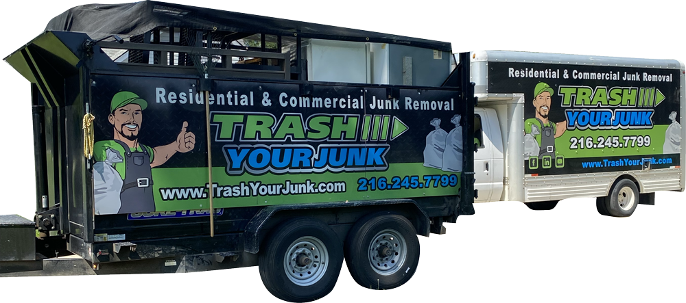 A trash truck and trailer are parked next to each other.
