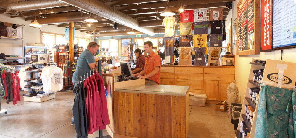 Man buying something at store counter