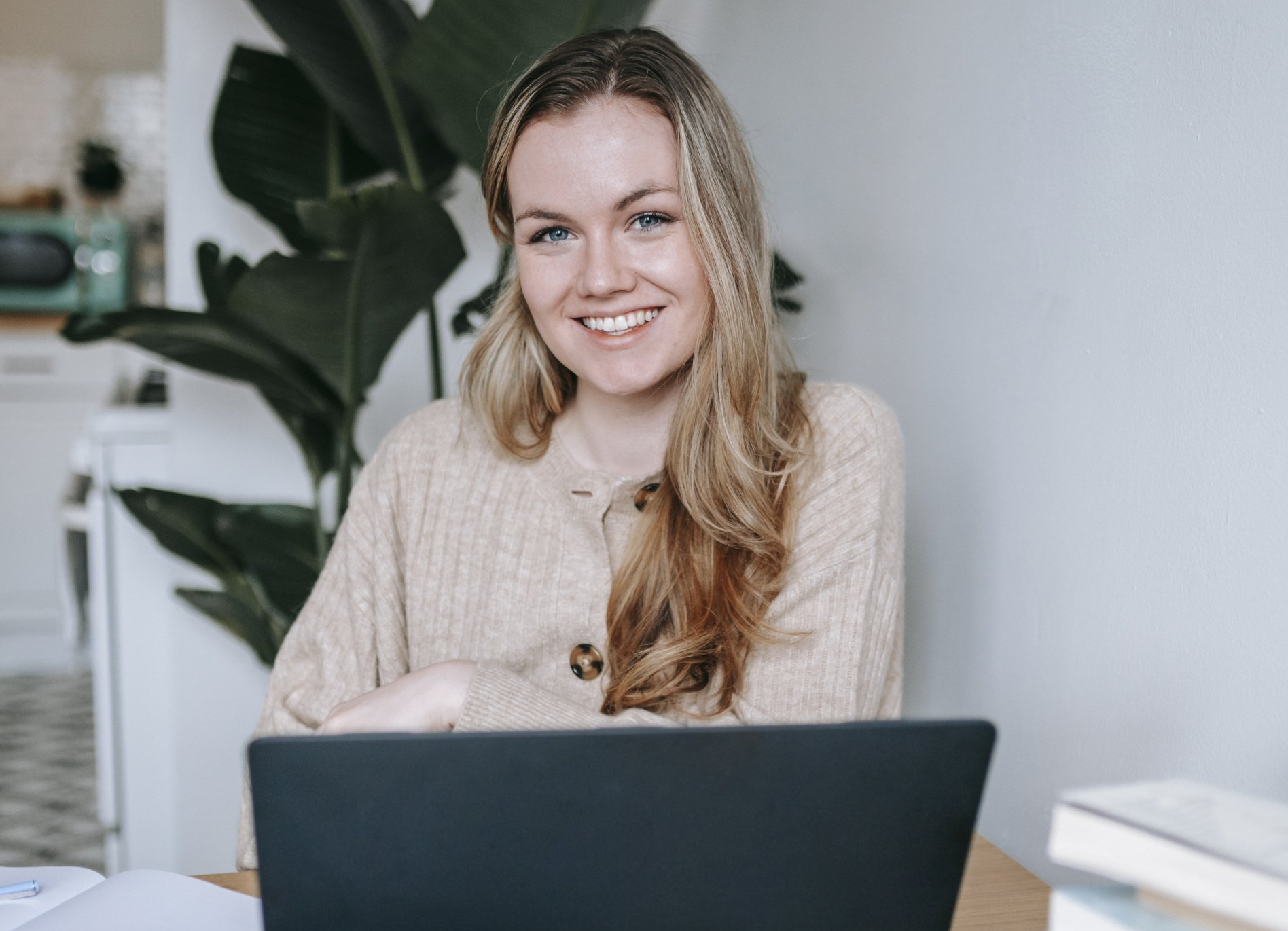 Woman smiling in front of computer