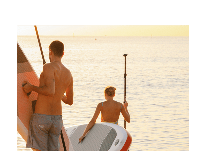 Couple going paddle boarding