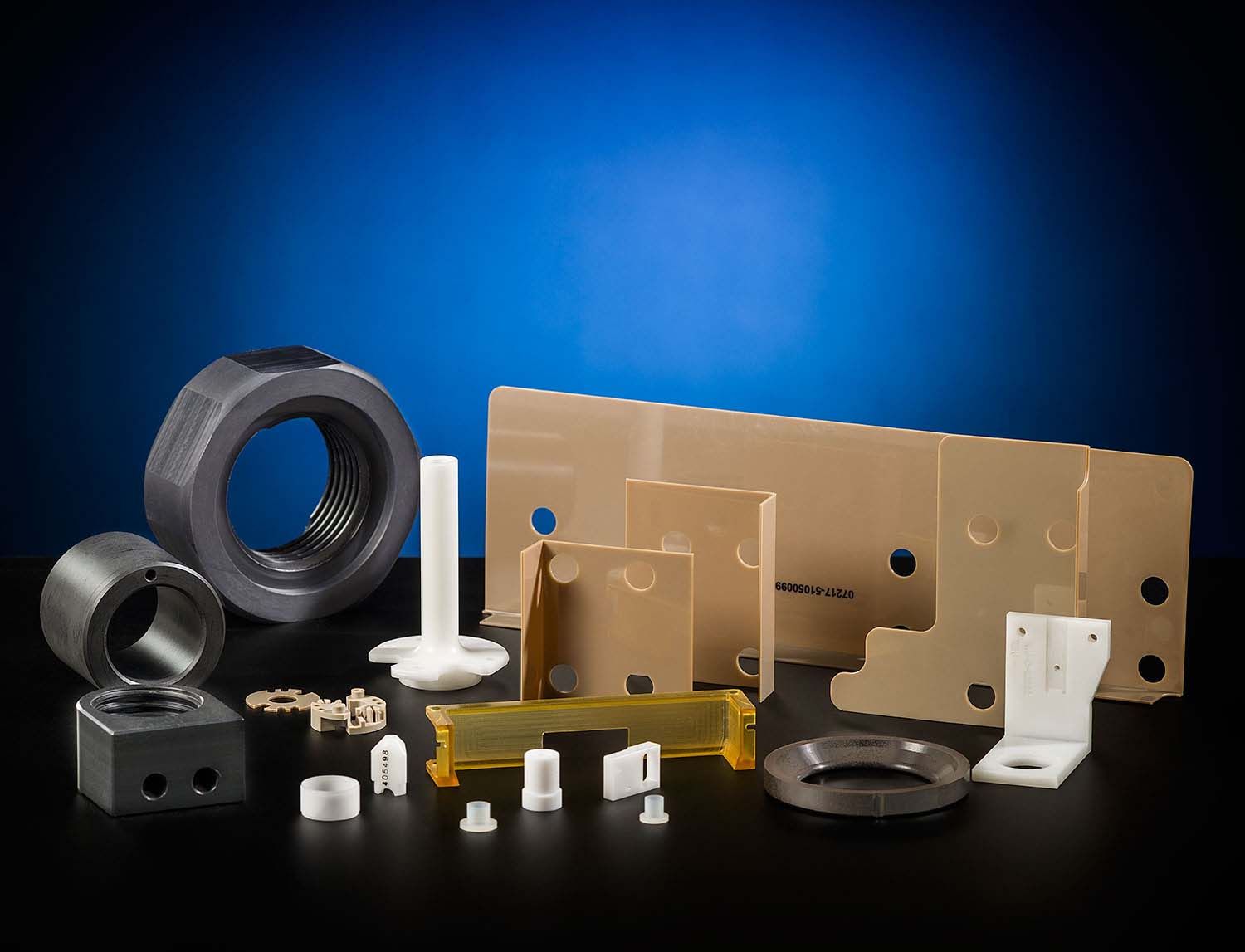 A variety of plastic parts are sitting on a table.