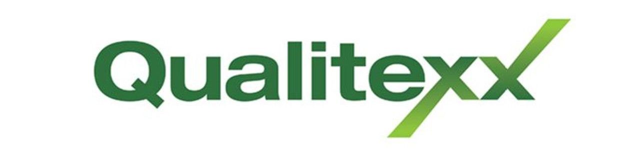 A green and white logo for a company called qualitexx