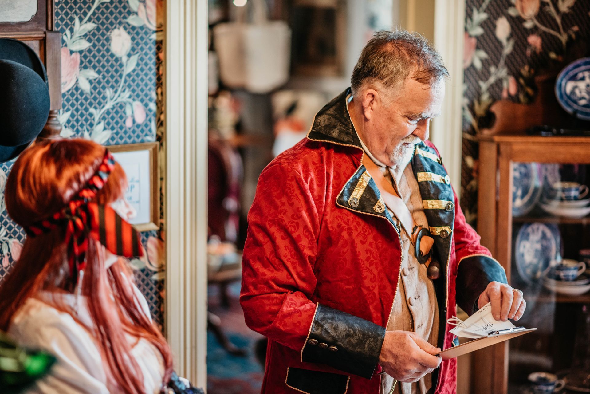 A man in a pirate costume is standing next to a woman in a pirate costume.