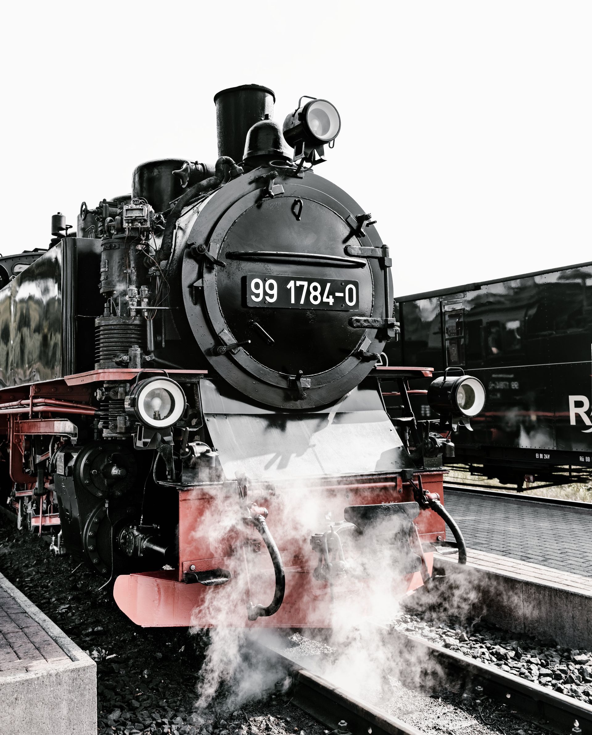 A black and red train with the number 99 on it