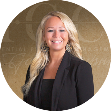 A woman with long blonde hair is smiling for the camera.