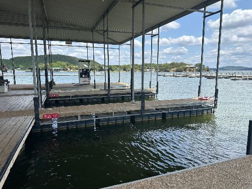 A large body of water with a dock in the middle of it.