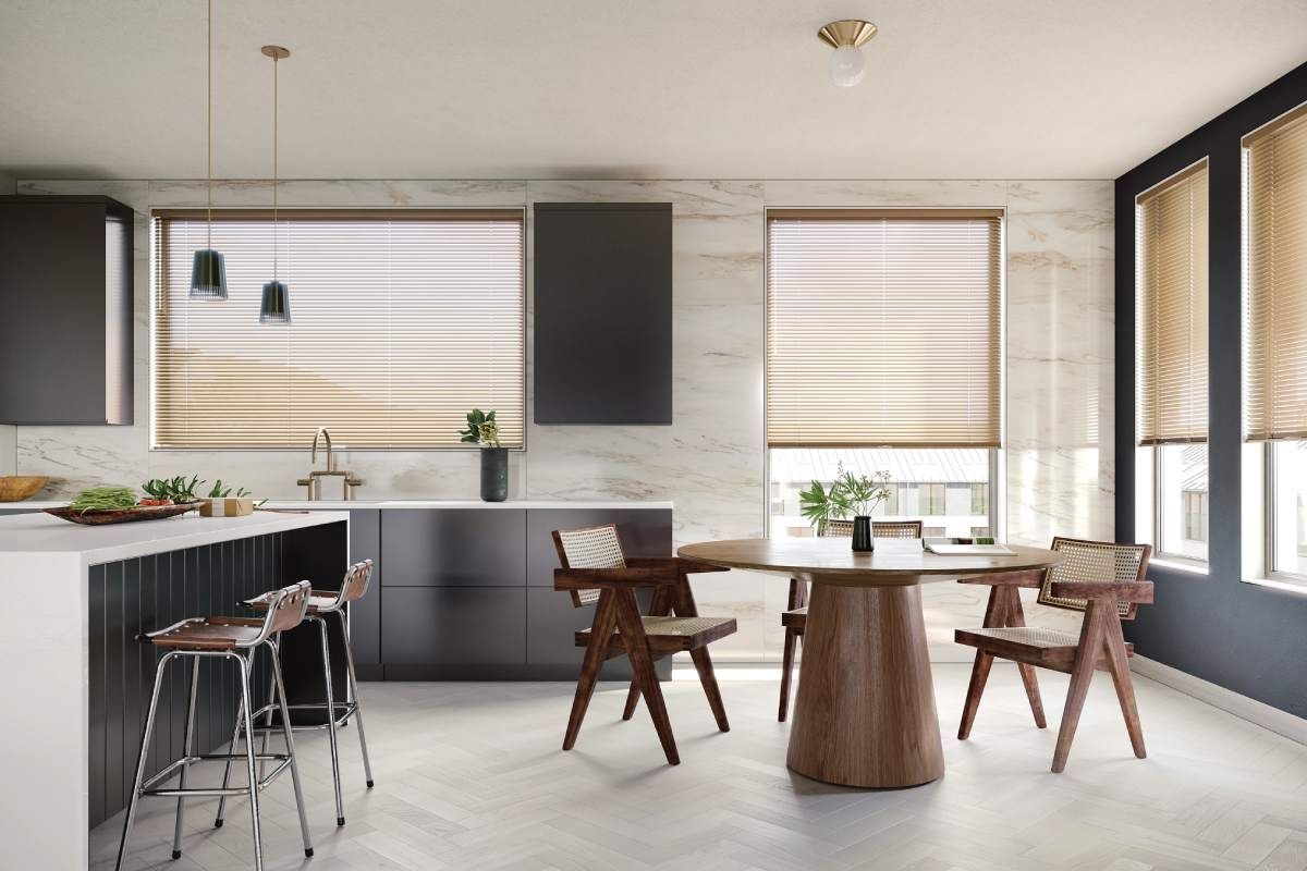 Modern kitchen and dining area with large windows, wood table, black cabinets, and bar stools