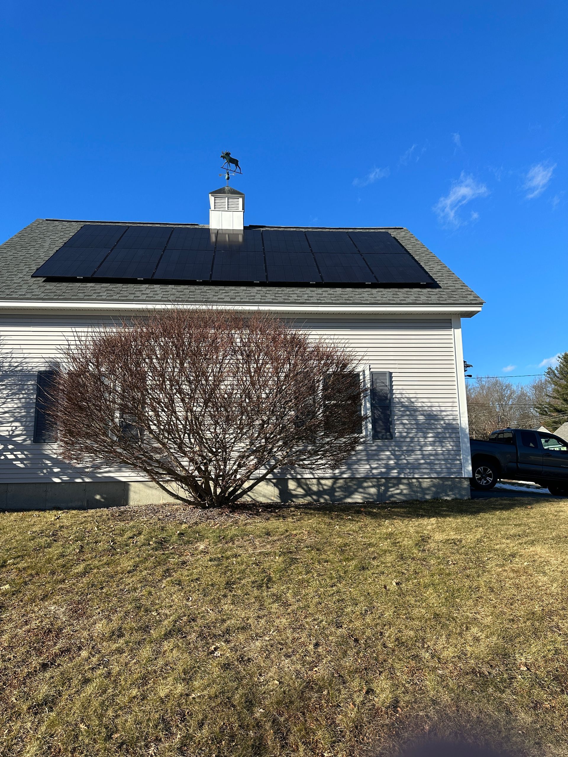 Rooftop solar panels providing energy savings in Dracut, MA.