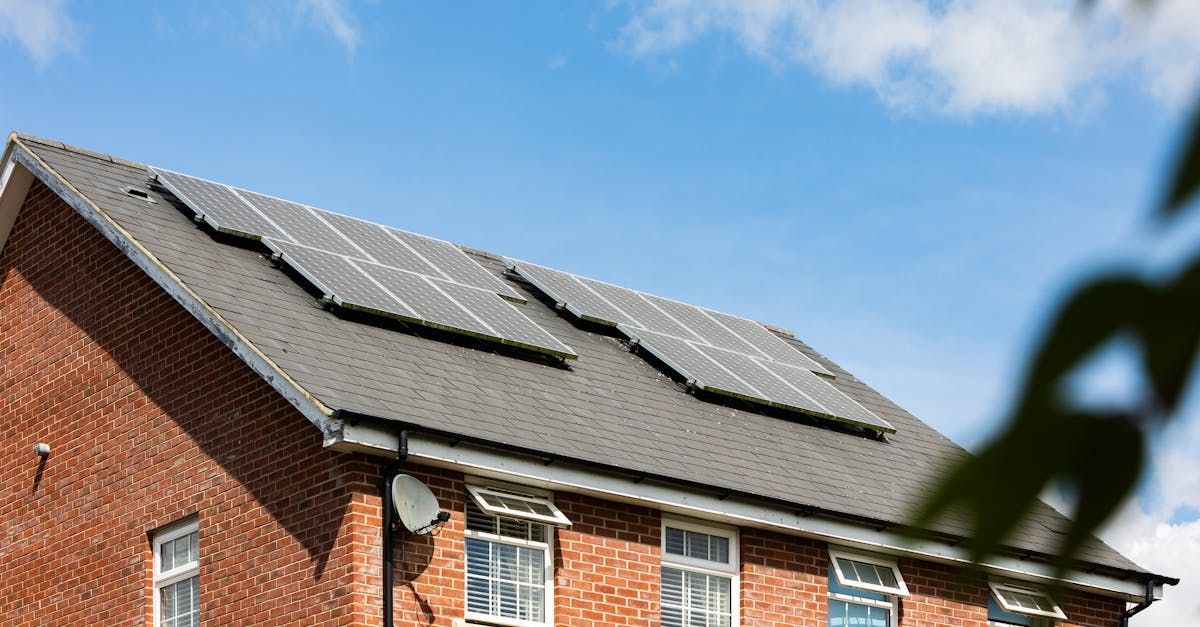 Home with asphalt shingle roof and solar panels installed by Dracut Solar in Dracut, MA.