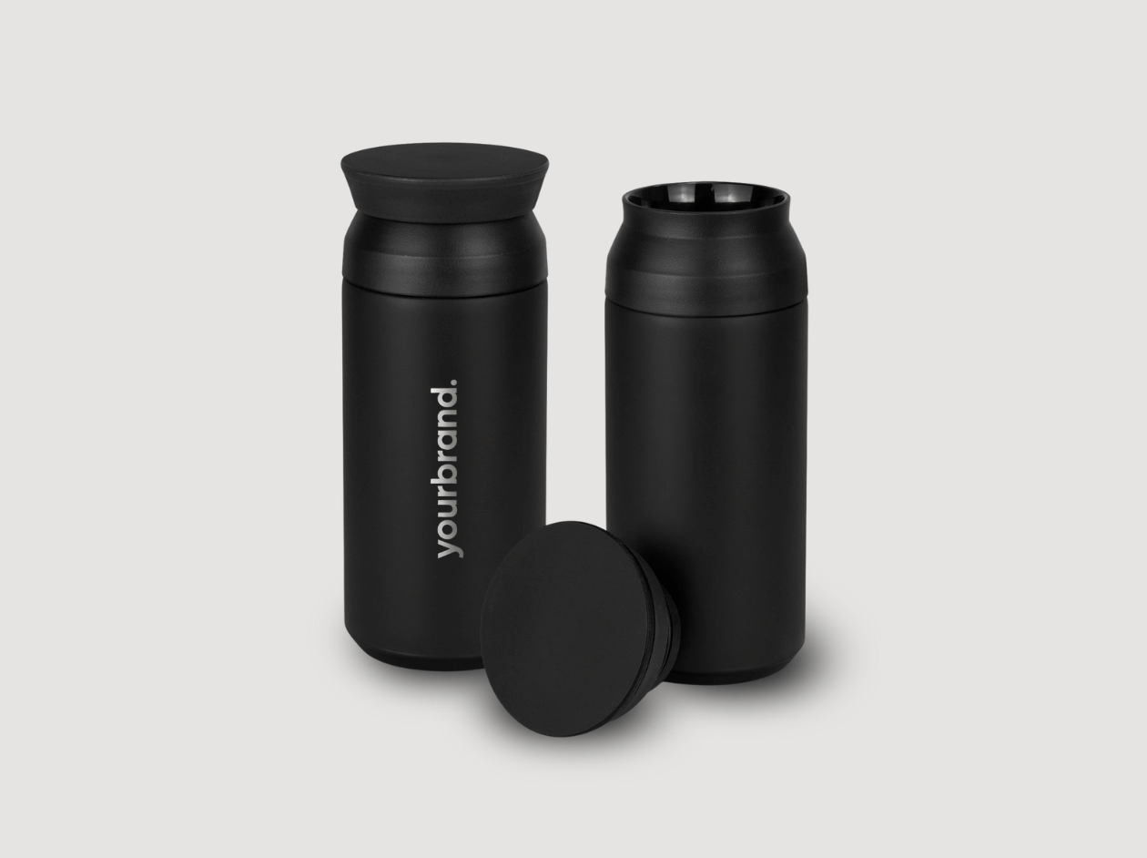 Three black reusable water bottles with matte finish, one cap placed in front.