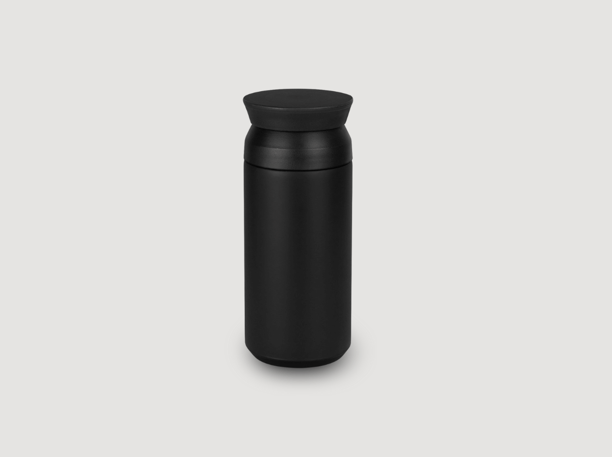 Black insulated travel mug on a light background