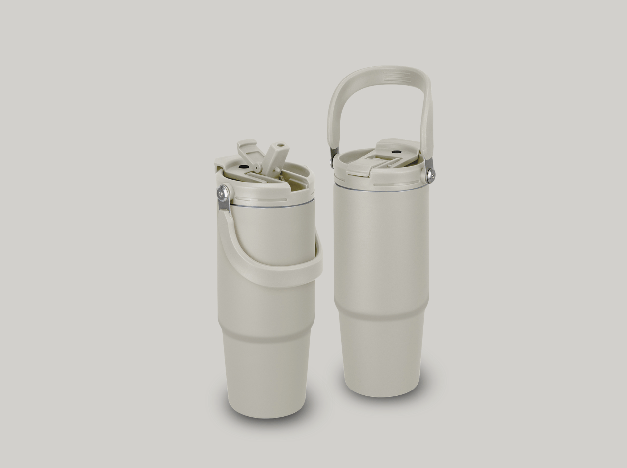 Two white insulated tumblers with lids, standing side by side on a light gray background