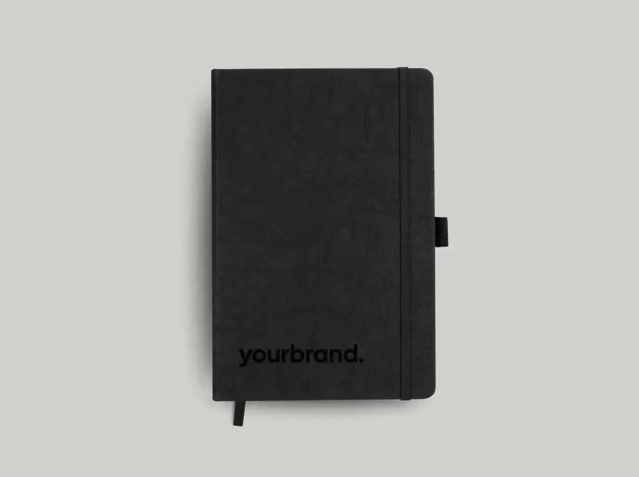 Black notebook or planner with “yourbrand.” logo on the cover, shown closed on a white background