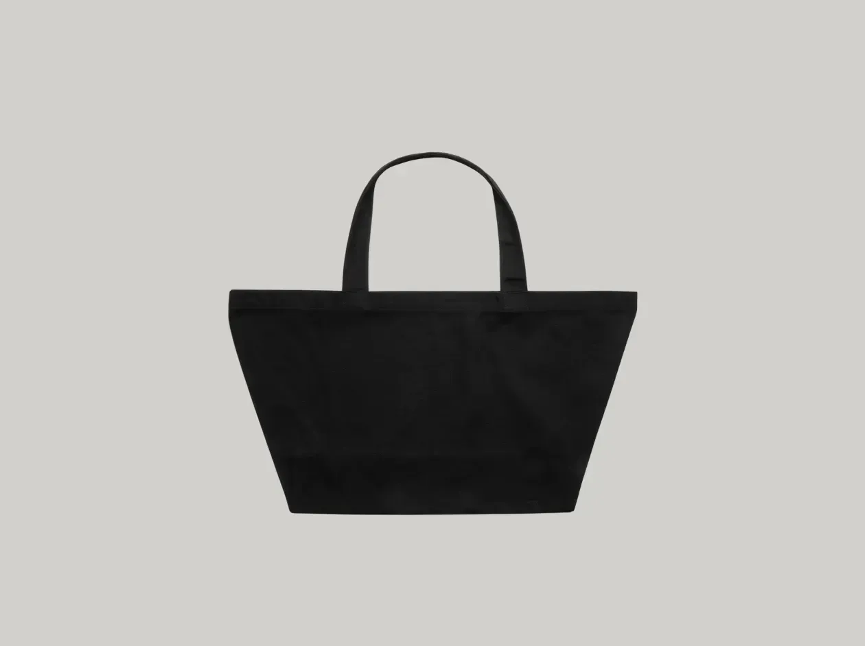 White tote bag with two handles on a light gray background