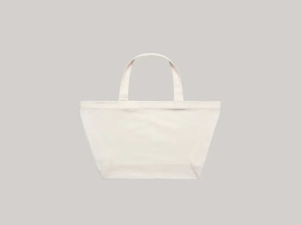 White tote bag with two handles on a light gray background