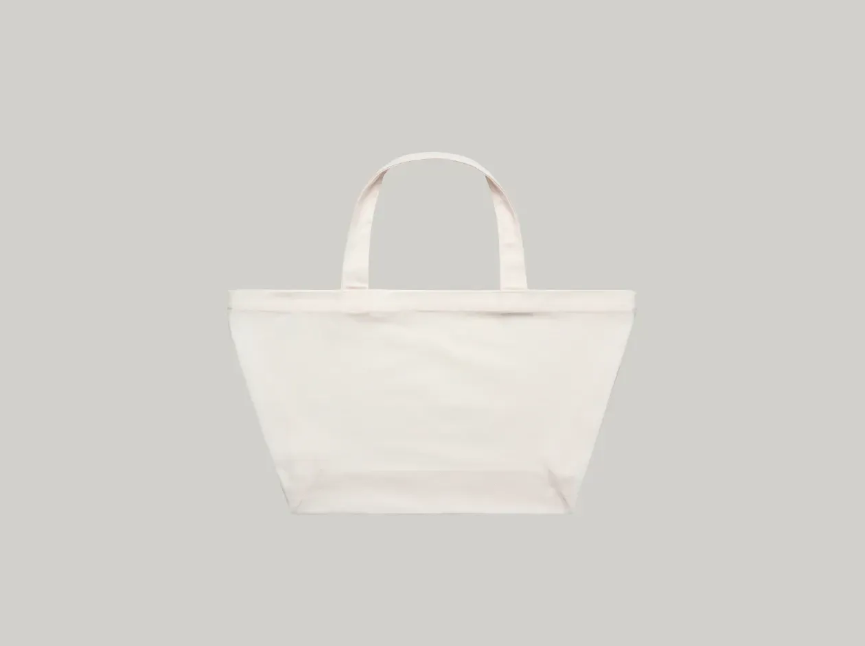 White tote bag with two handles on a light gray background