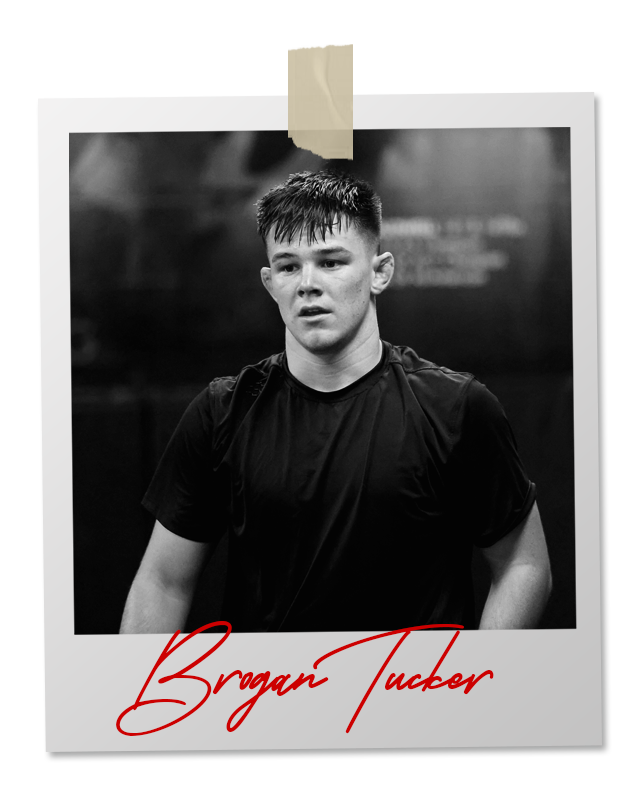 A black and white photo of a wrestler in an 
