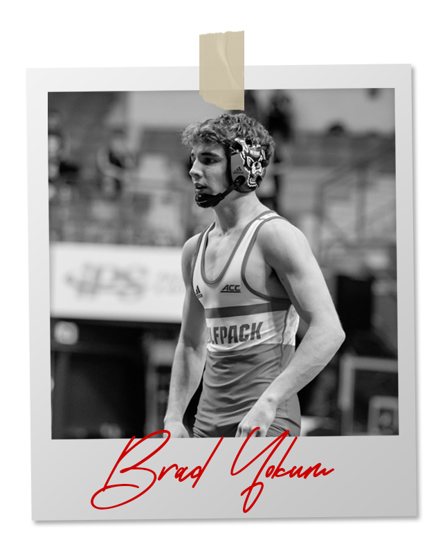 A black and white photo of a wrestler in an 