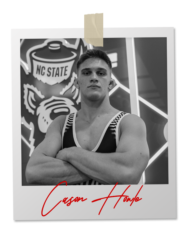 A black and white photo of a wrestler in an 