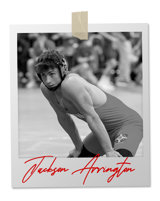 A black and white photo of a wrestler in an 