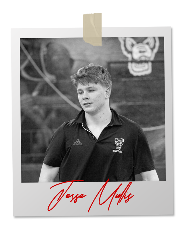 A black and white photo of a wrestler in an 