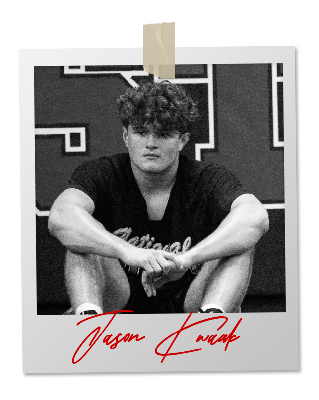 A black and white photo of a wrestler in an 