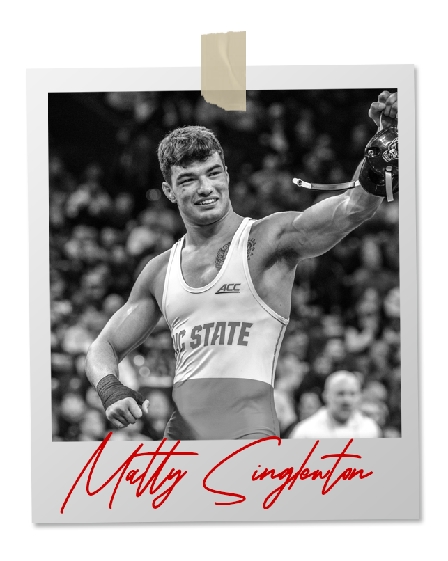 A black and white photo of a wrestler in an 