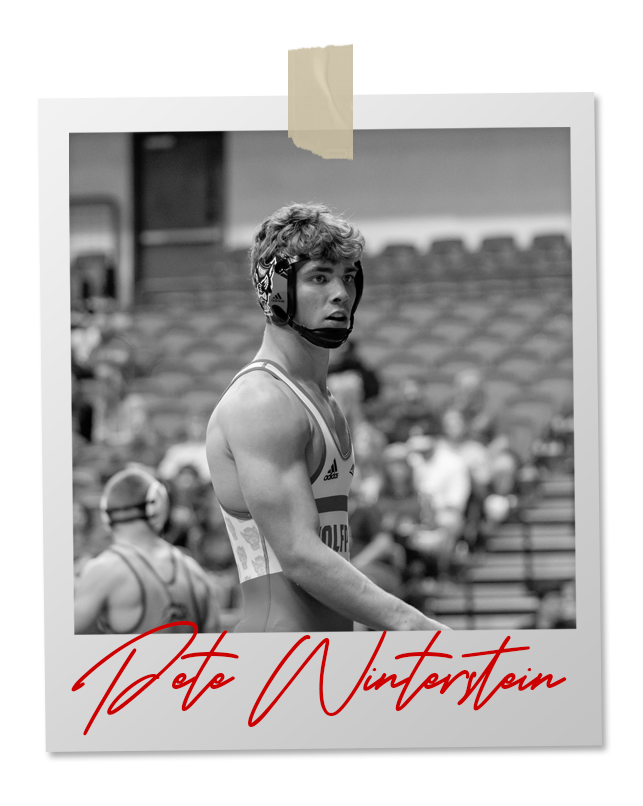 A black and white photo of a wrestler in an 
