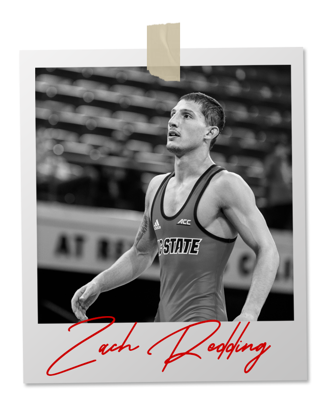 A black and white photo of a wrestler in an 
