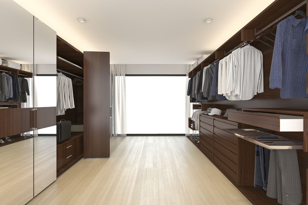 A Walk in Closet With Lots of Clothes and a Large Window — Wardrobe World In Paget, QLD