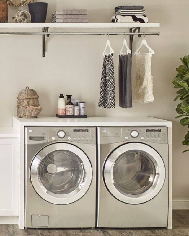 A Laundry Room With Two Stainless Steel Washers and Dryers — Wardrobe World In Paget, QLD