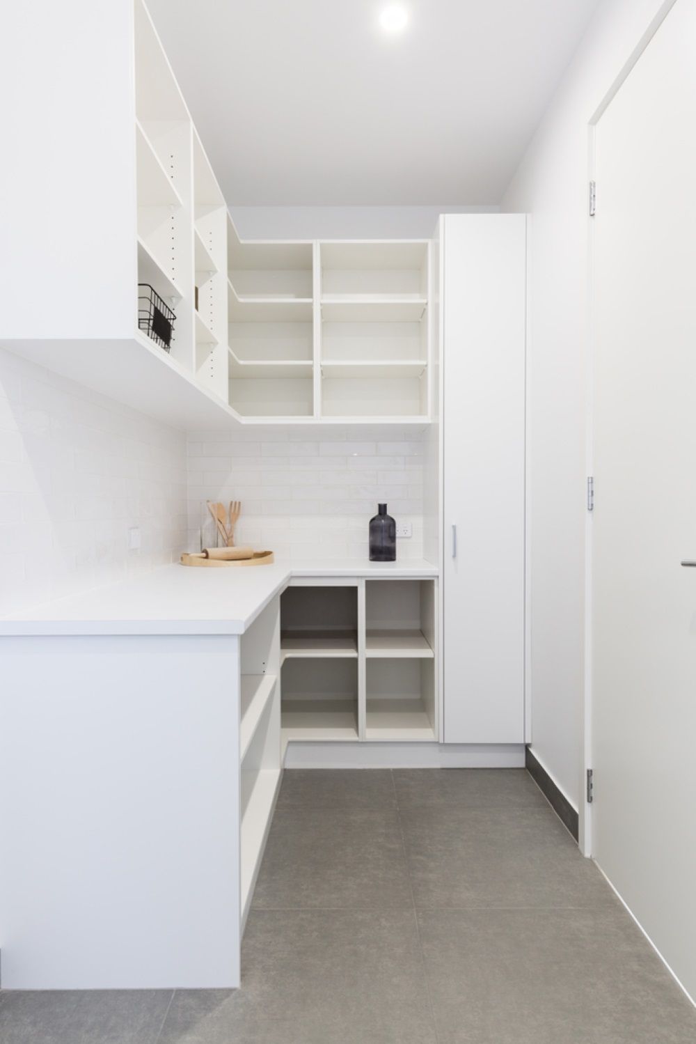 A Kitchen With White Cabinets and Shelves and a Bottle on the Counter — Wardrobe World In Paget, QLD