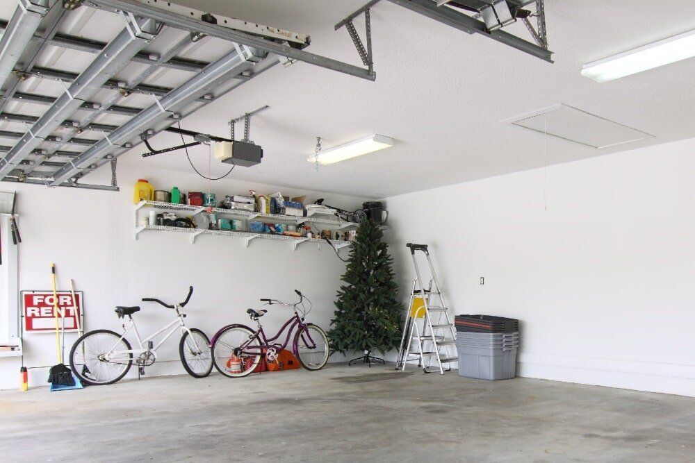 A Garage With Bikes and a Christmas Tree and a Sign That Says for Rent — Wardrobe World In Paget, QLD
