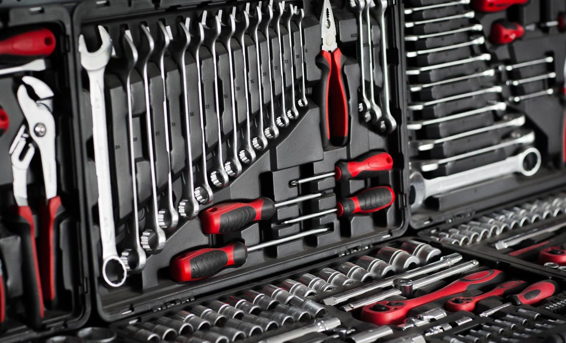 A close up of a toolbox filled with lots of tools.