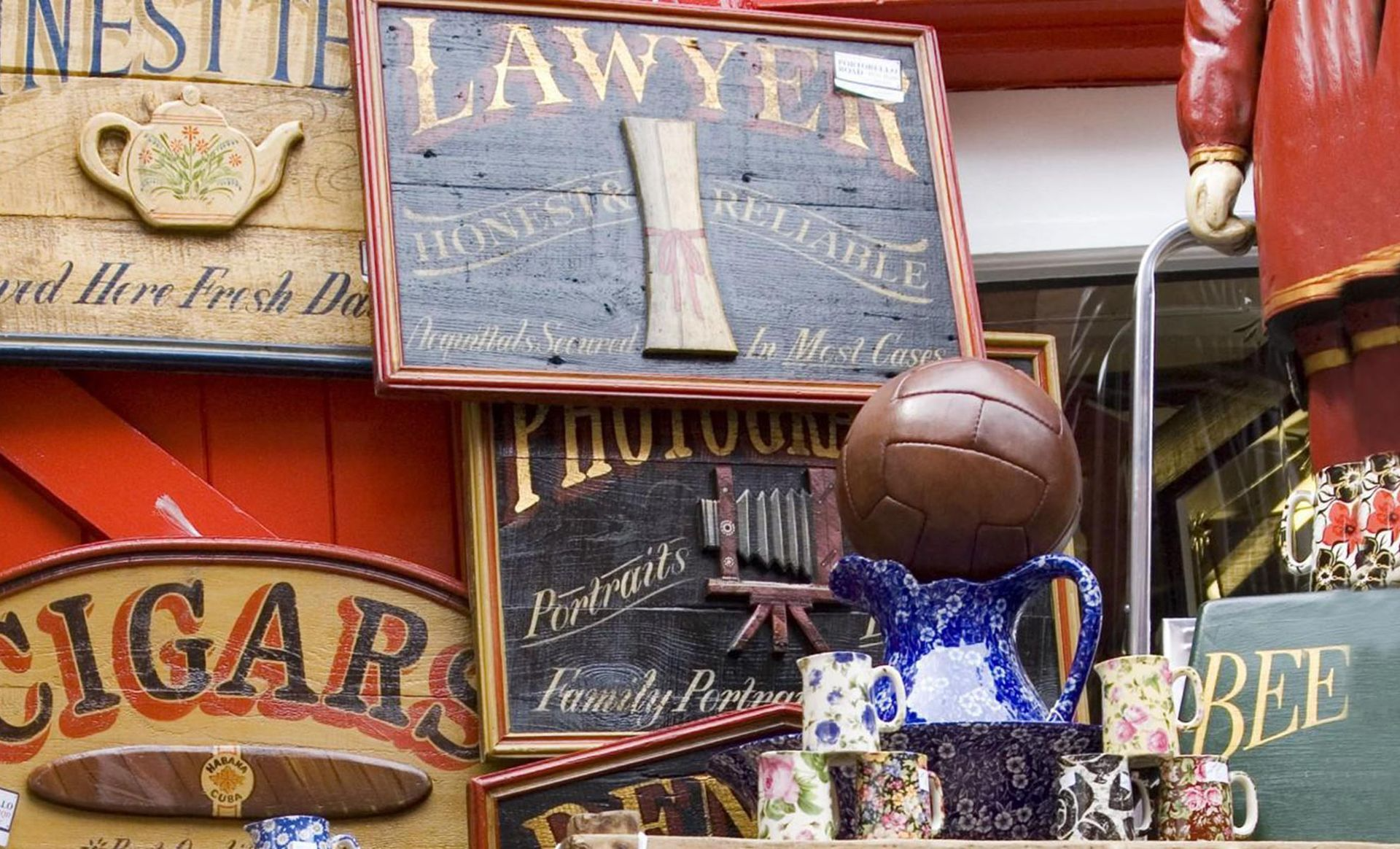A stack of signs including one that says ' lawyer ' on it