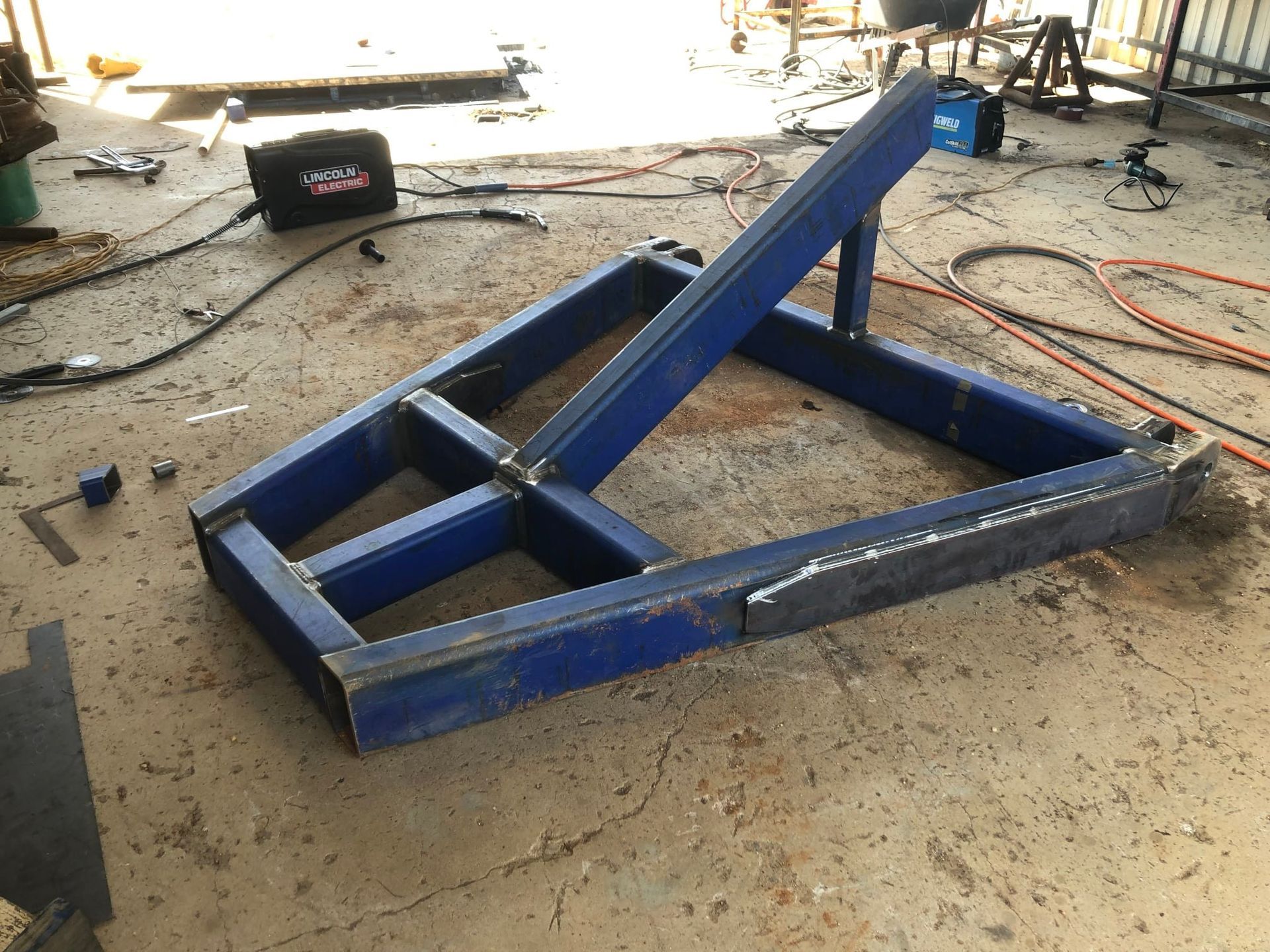 Blue Welded Steel Frame Construction — Australian Mobile Welding Pty Ltd in Mareeba, QLD