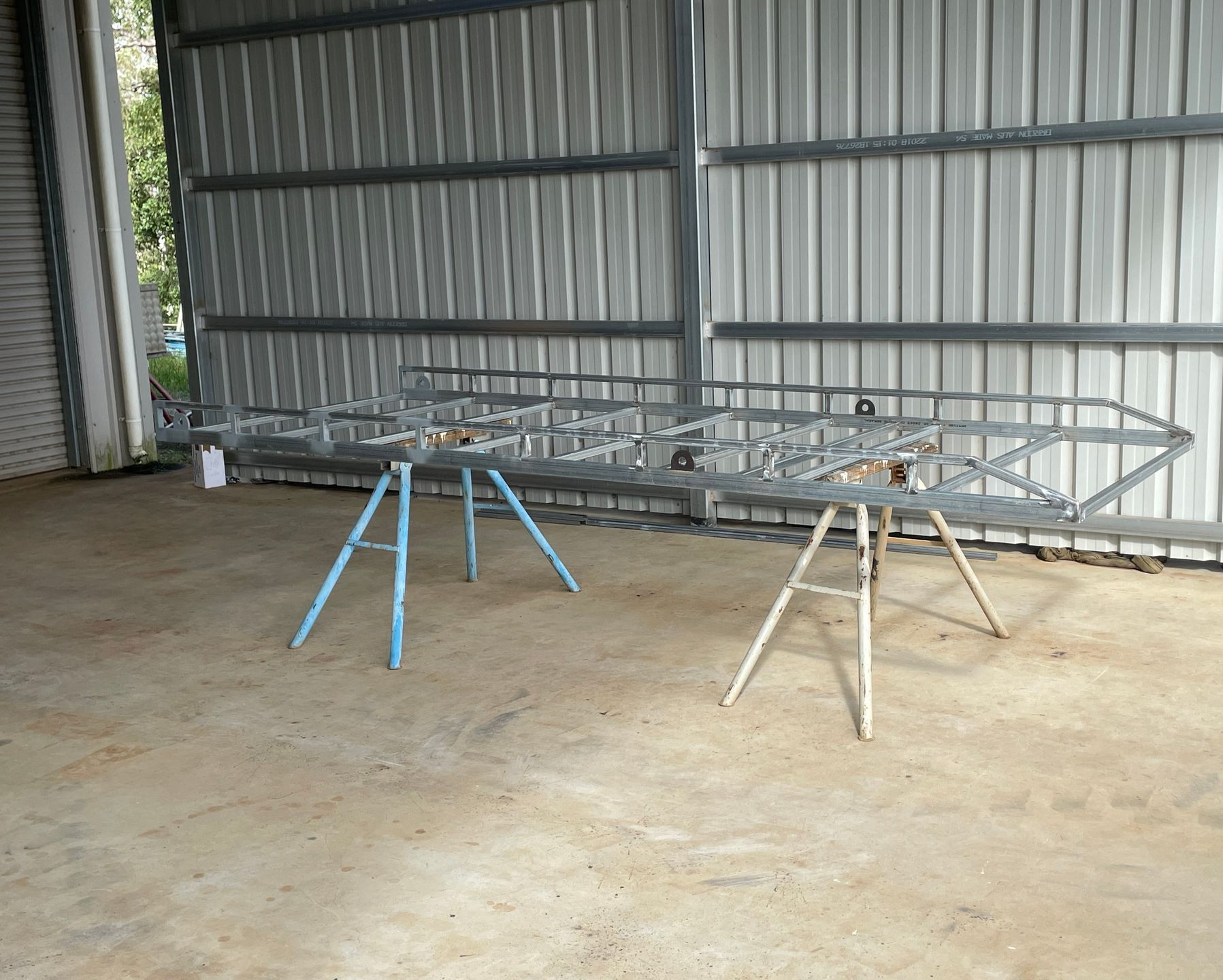 Person Welding Metal Frame — Australian Mobile Welding Pty Ltd in Atherton, QLD
