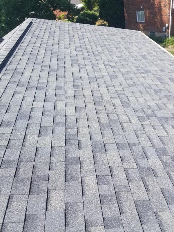 Gray asphalt shingle roof.